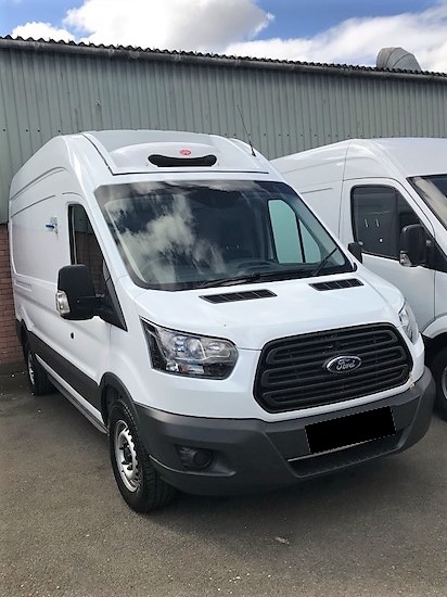 A white Ford Transit refrigerated van.